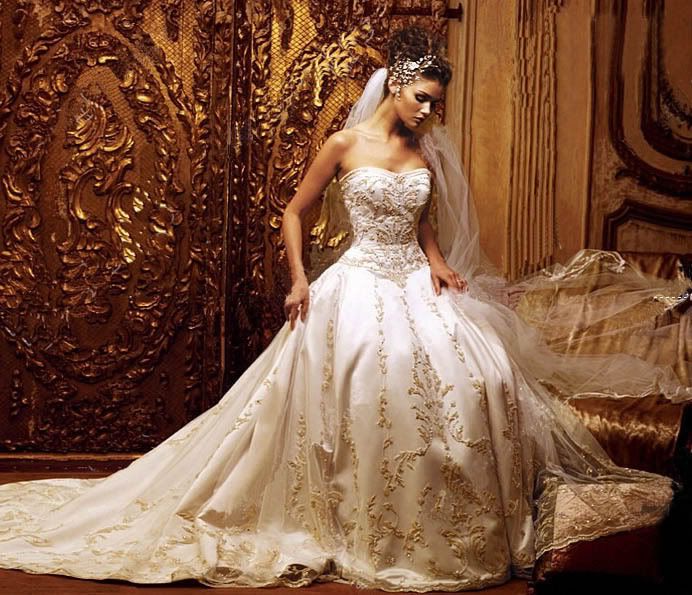 An amazingly detailed embroidered gold cream ballgown wedding dress.
